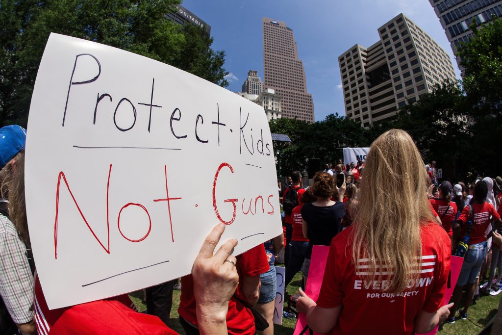 Everytown Moms Demand Action gun control protest sign protect kids