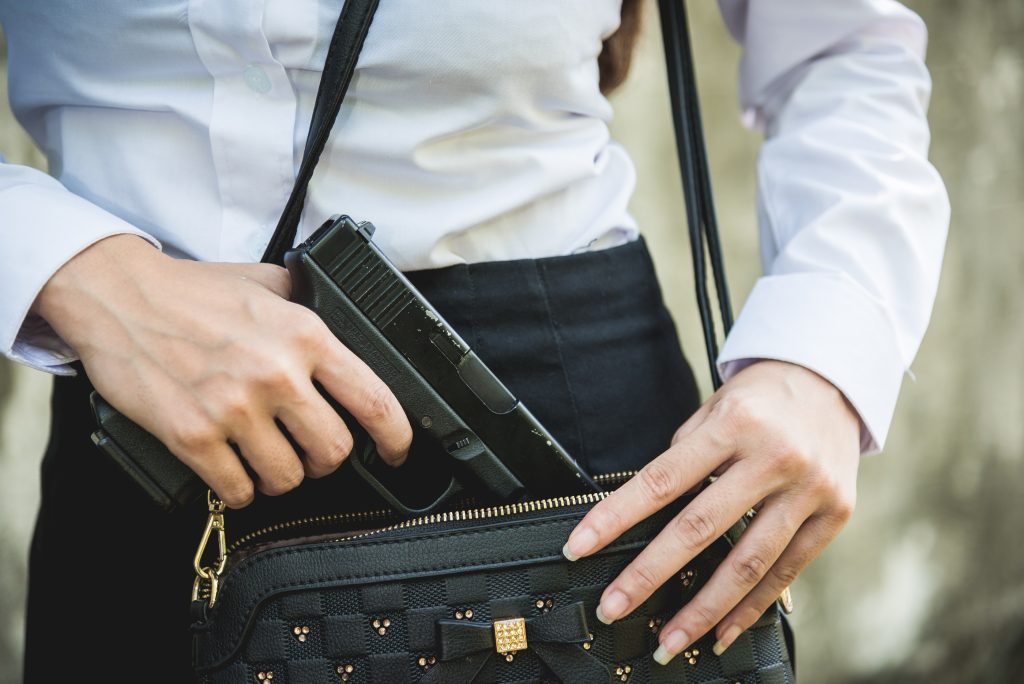 woman gun purse concealed carry handgun